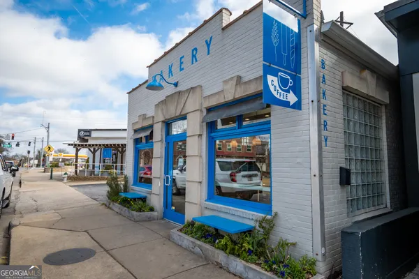 a front view of a building with retail shops