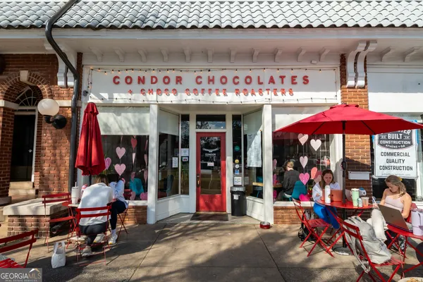 a view of people sitting in front of retail shop