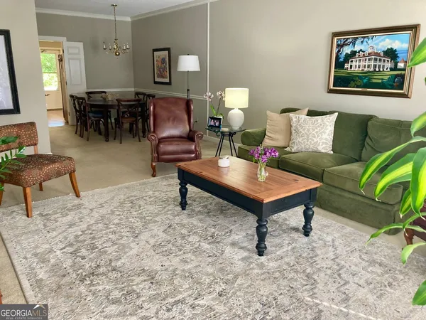 a living room with furniture and a table