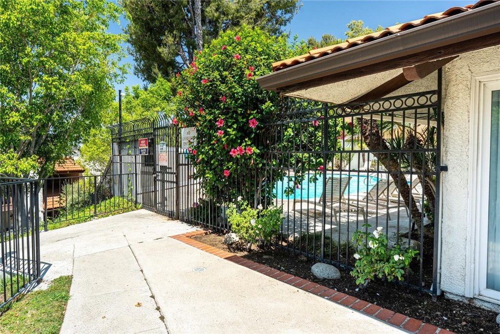 9576 Vía Bernardo Burbank, CA 91504 - Photo 37 of 38 a view of a house with a small yard plants and a large tree