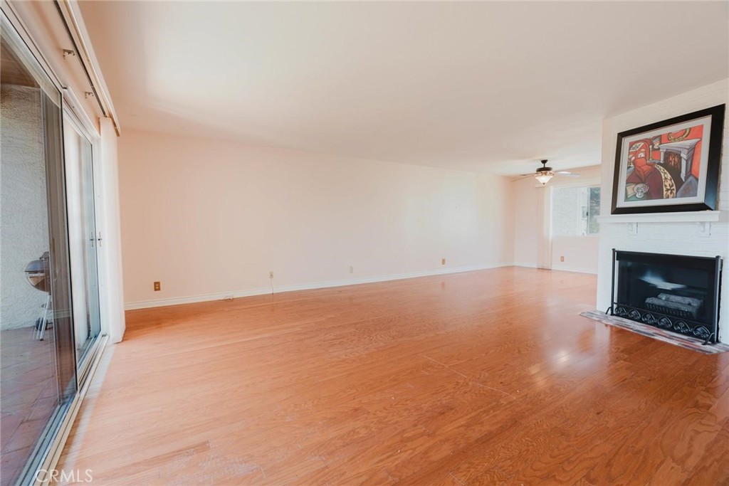 9576 Vía Bernardo Burbank, CA 91504 - Photo 6 of 38 a view of an empty room with a fireplace and a window