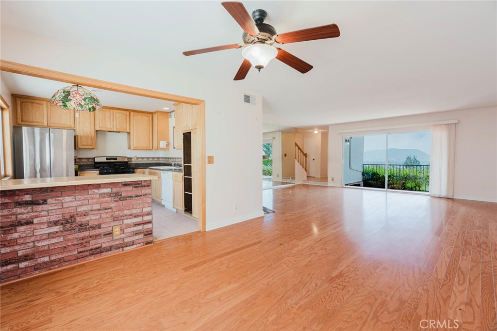 9576 Vía Bernardo Burbank, CA 91504 - Photo 8 of 38 a view of a kitchen with kitchen island a counter top space and stainless steel appliances wooden floor