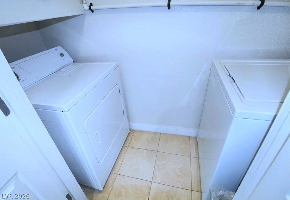 3135 South Mojave Road, Unit 156 Las Vegas, NV 89121 - Photo 11 of 18 A dedicated laundry space provides practical amenities with washer and dryer units.