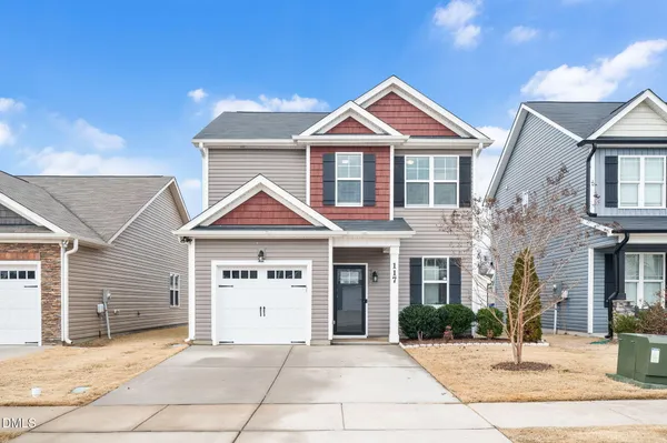 a front view of a house with a yard