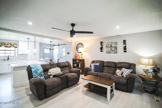 a living room with furniture and a window