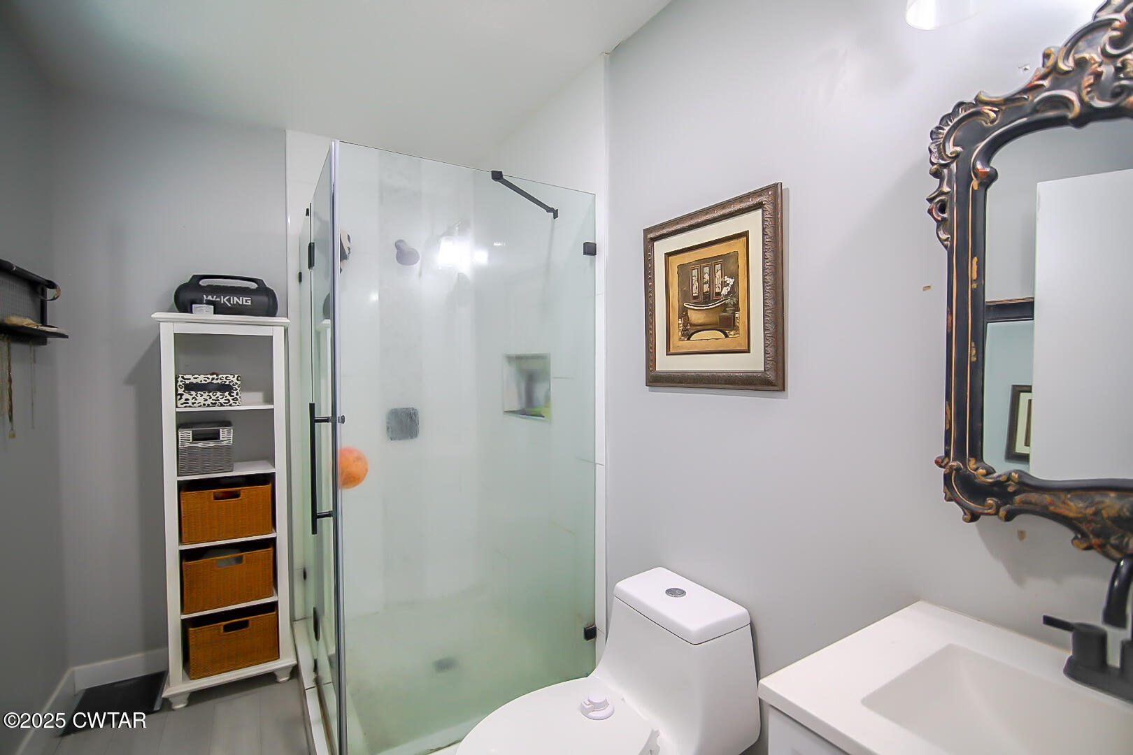 1374 Mifflin Road Jackson, TN 38301 - Photo 15 of 23 a white toilet sitting next to a bathroom sink