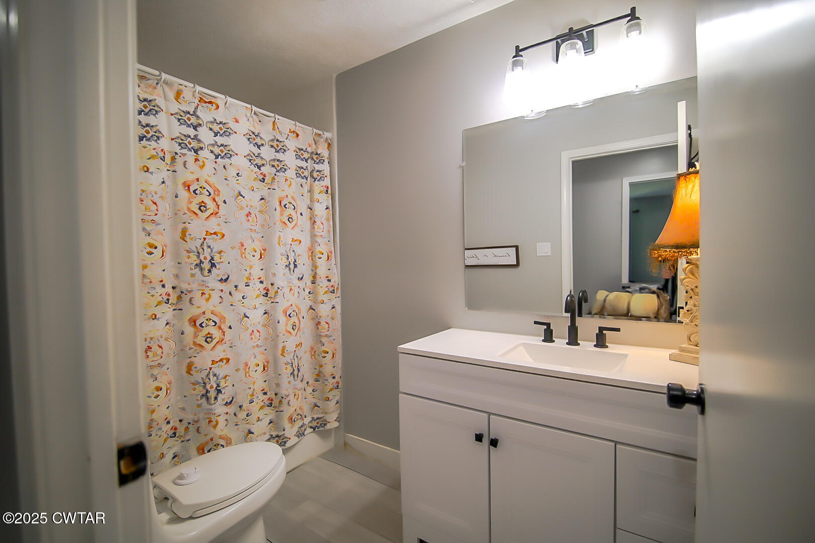 1374 Mifflin Road Jackson, TN 38301 - Photo 17 of 23 a bathroom with a sink toilet and shower