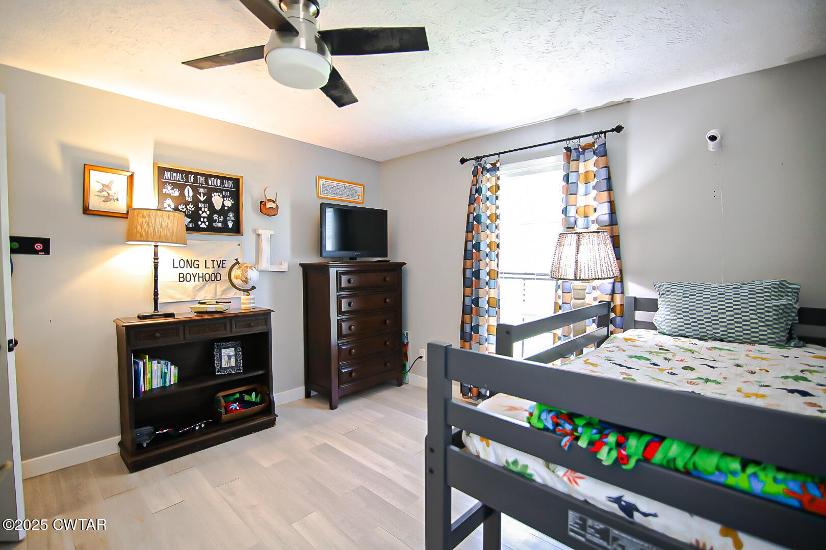 1374 Mifflin Road Jackson, TN 38301 - Photo 19 of 23 a bedroom with a bed a flat screen tv and a couch