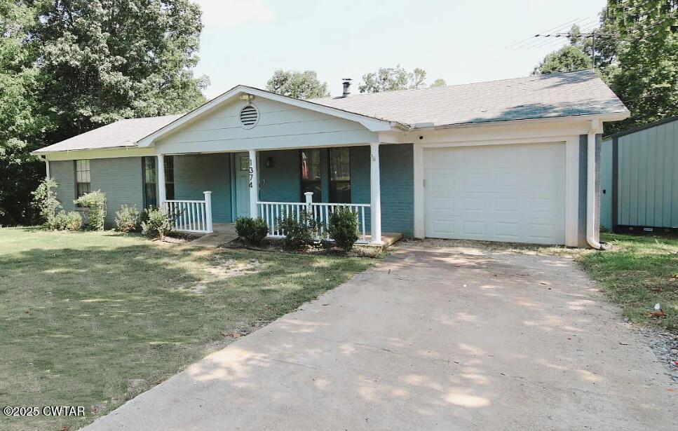 1374 Mifflin Road Jackson, TN 38301 - Photo 2 of 23 a front view of a house with garden