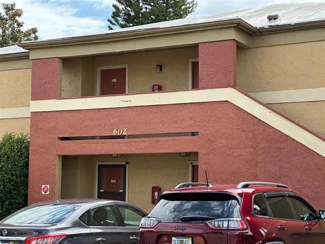 a front view of a house with parking space