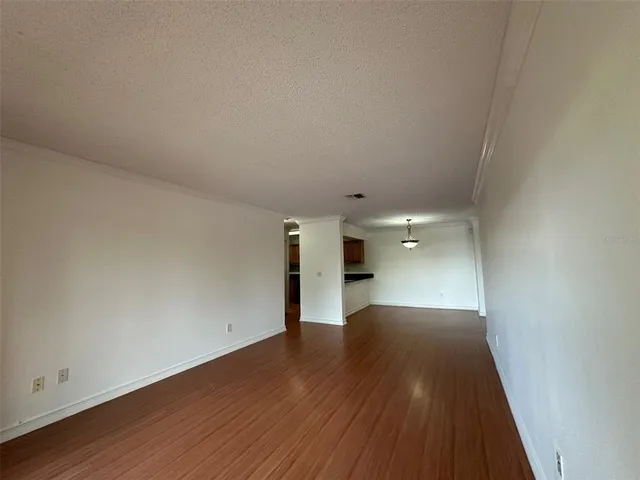 a kitchen with stainless steel appliances a refrigerator and a stove top oven