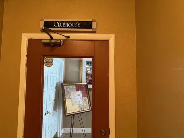 a room with gym equipment and windows