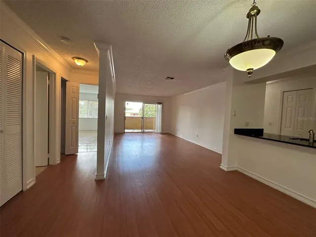 an empty room with wooden floor
