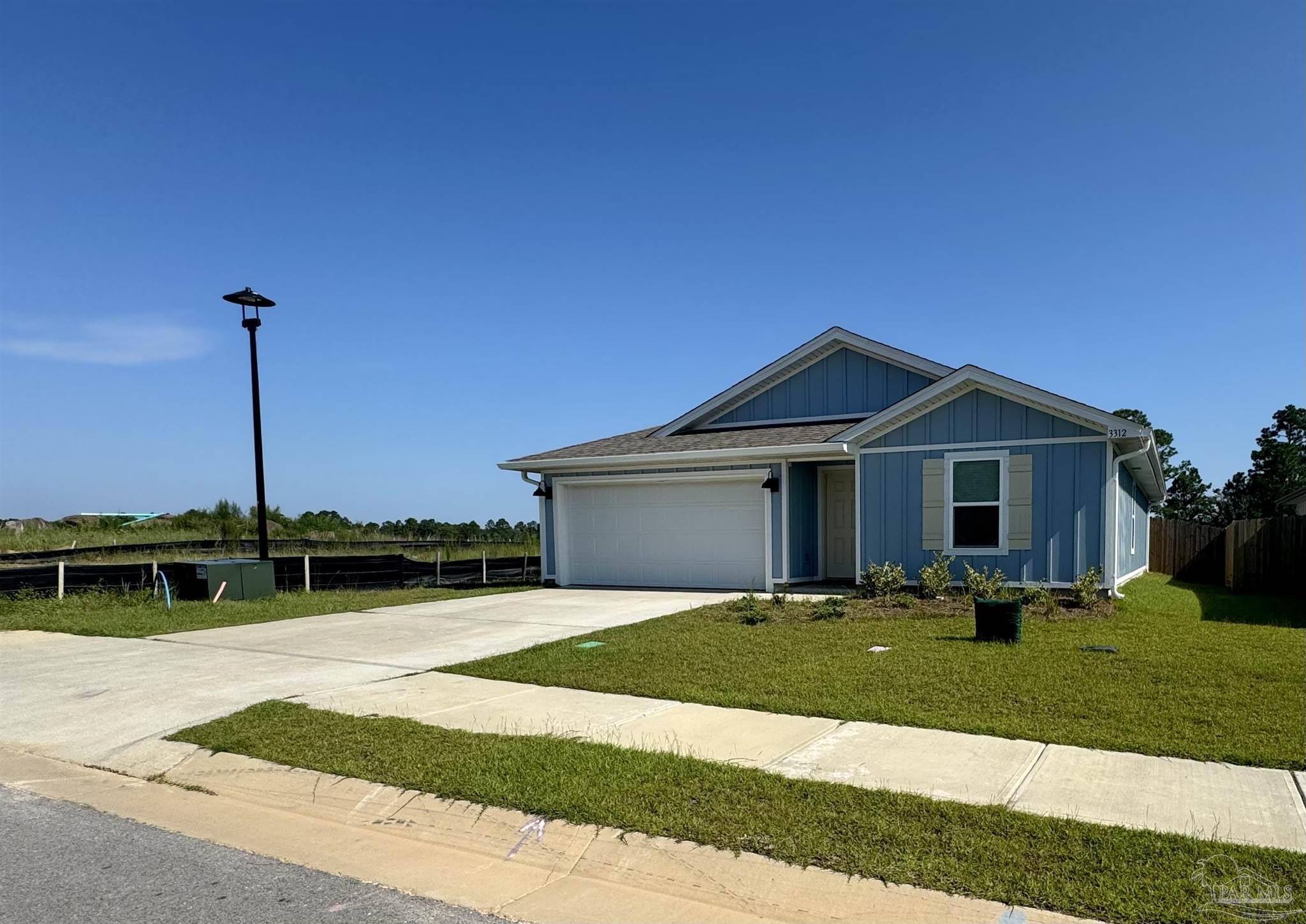 3312 Harrier Road Pace, FL 32571 - Photo 3 of 35 a view of a house with a yard