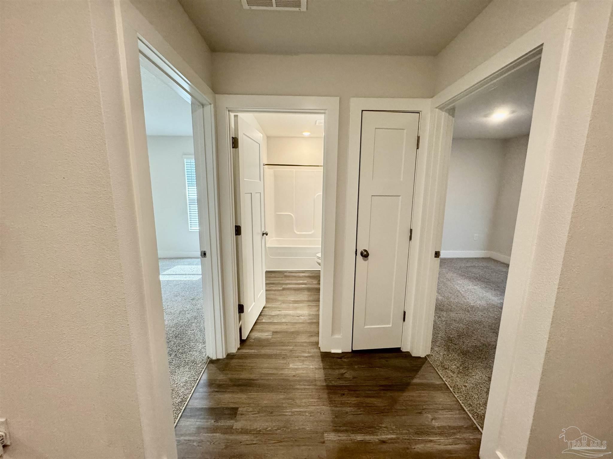 3312 Harrier Road Pace, FL 32571 - Photo 6 of 35 a view of a hallway with wooden floor