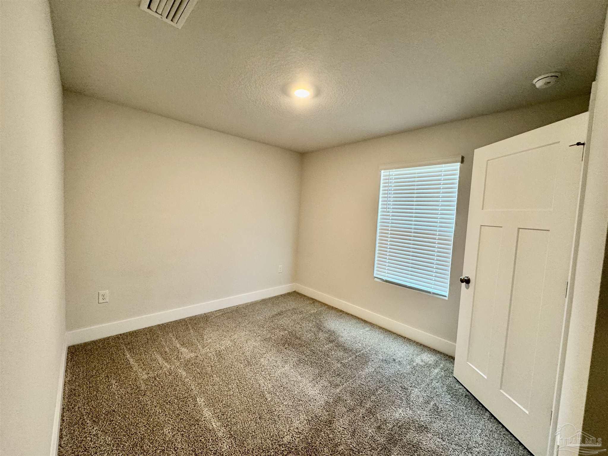 3312 Harrier Road Pace, FL 32571 - Photo 7 of 35 an empty room with windows