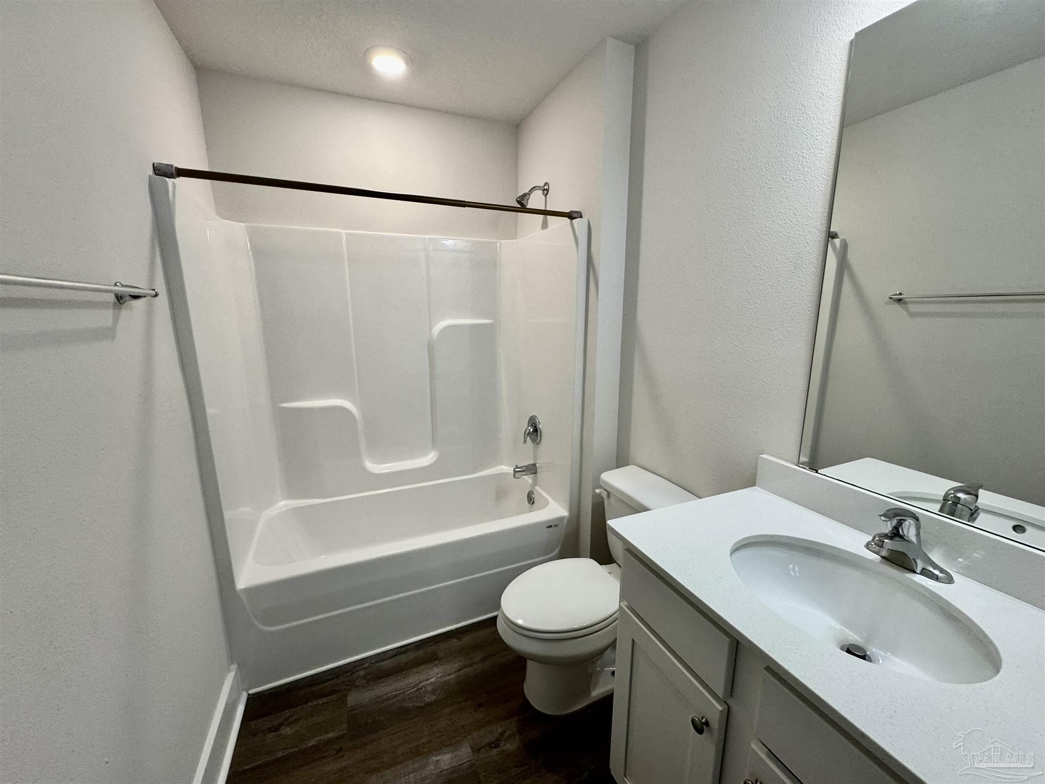 3312 Harrier Road Pace, FL 32571 - Photo 9 of 35 a bathroom with a sink toilet a mirror and shower