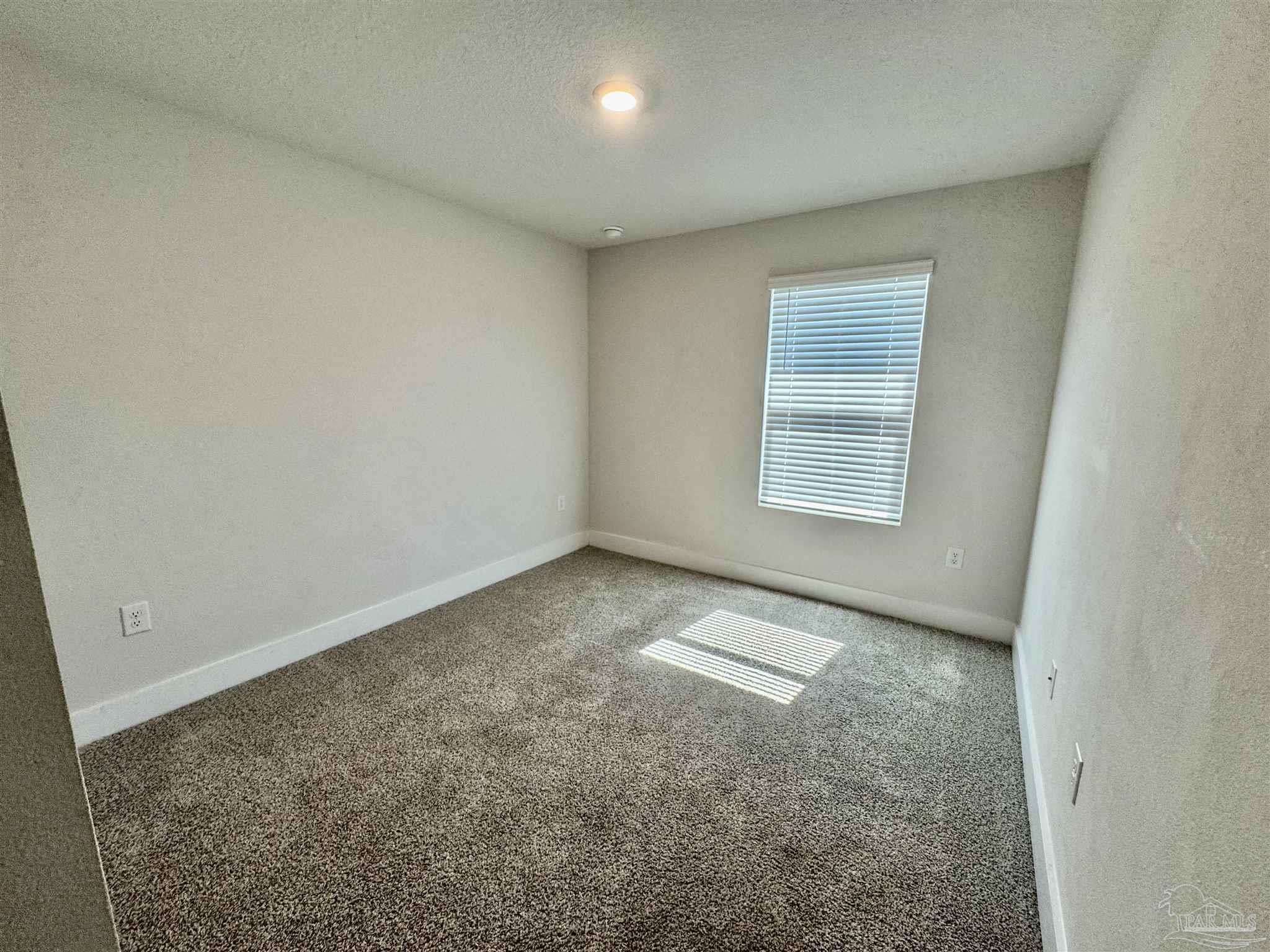 3312 Harrier Road Pace, FL 32571 - Photo 10 of 35 an empty room with windows