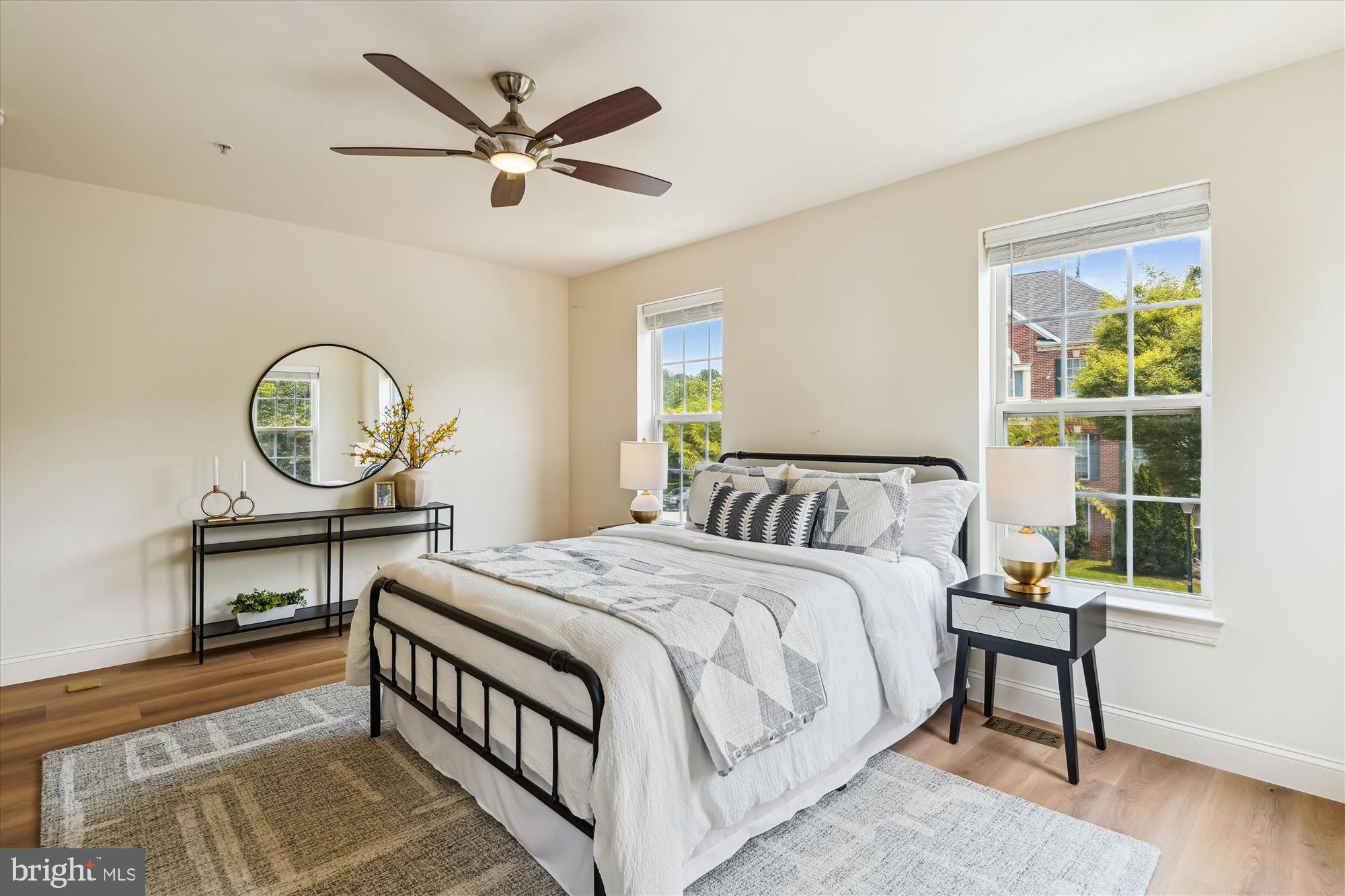 604 Highland Ridge Avenue, Unit 100 Gaithersburg, MD 20878 - Photo 18 of 46 a bed room with a bed a window and a chandelier
