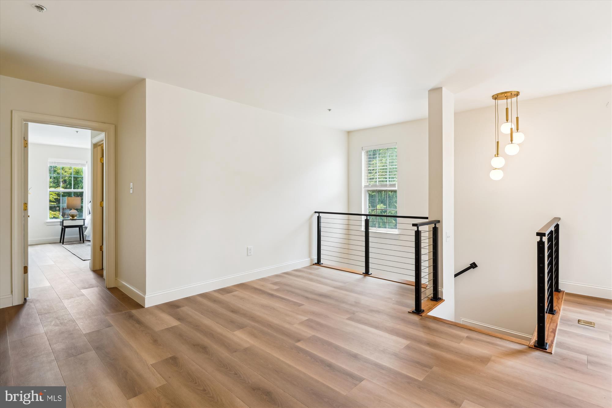 604 Highland Ridge Avenue, Unit 100 Gaithersburg, MD 20878 - Photo 31 of 46 a view of a room with wooden floor staircase and living room