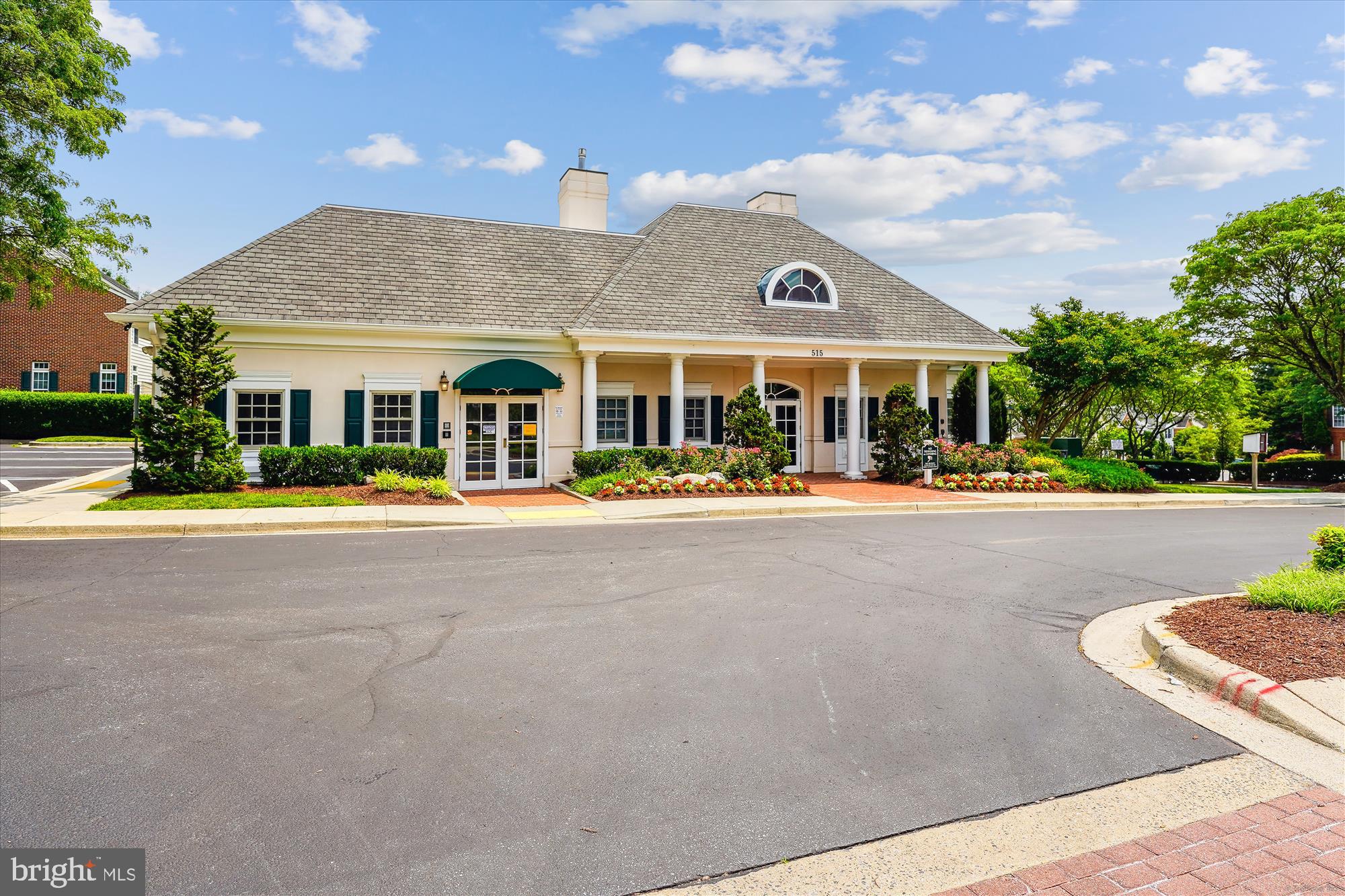 604 Highland Ridge Avenue, Unit 100 Gaithersburg, MD 20878 - Photo 36 of 46 a front view of building with small garden and statue
