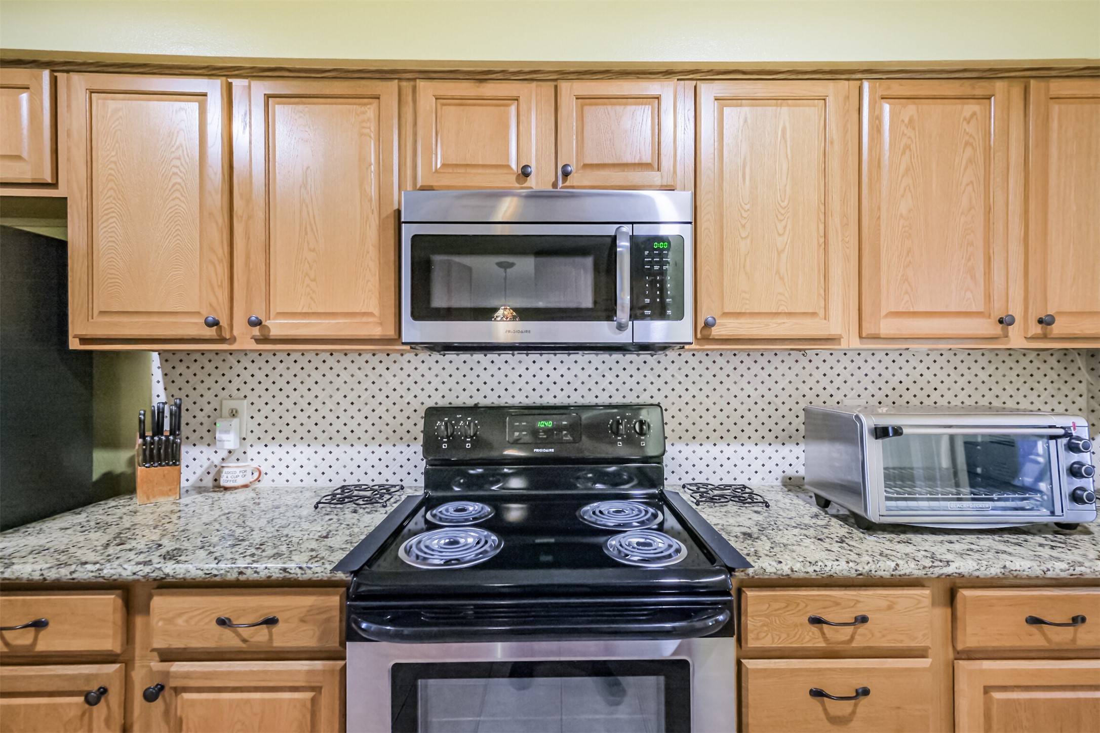 14708 Perthshire Road, Unit A Houston, TX 77079 - Photo 4 of 25 The kitchen features plenty of storage and stainless steel appliances.
