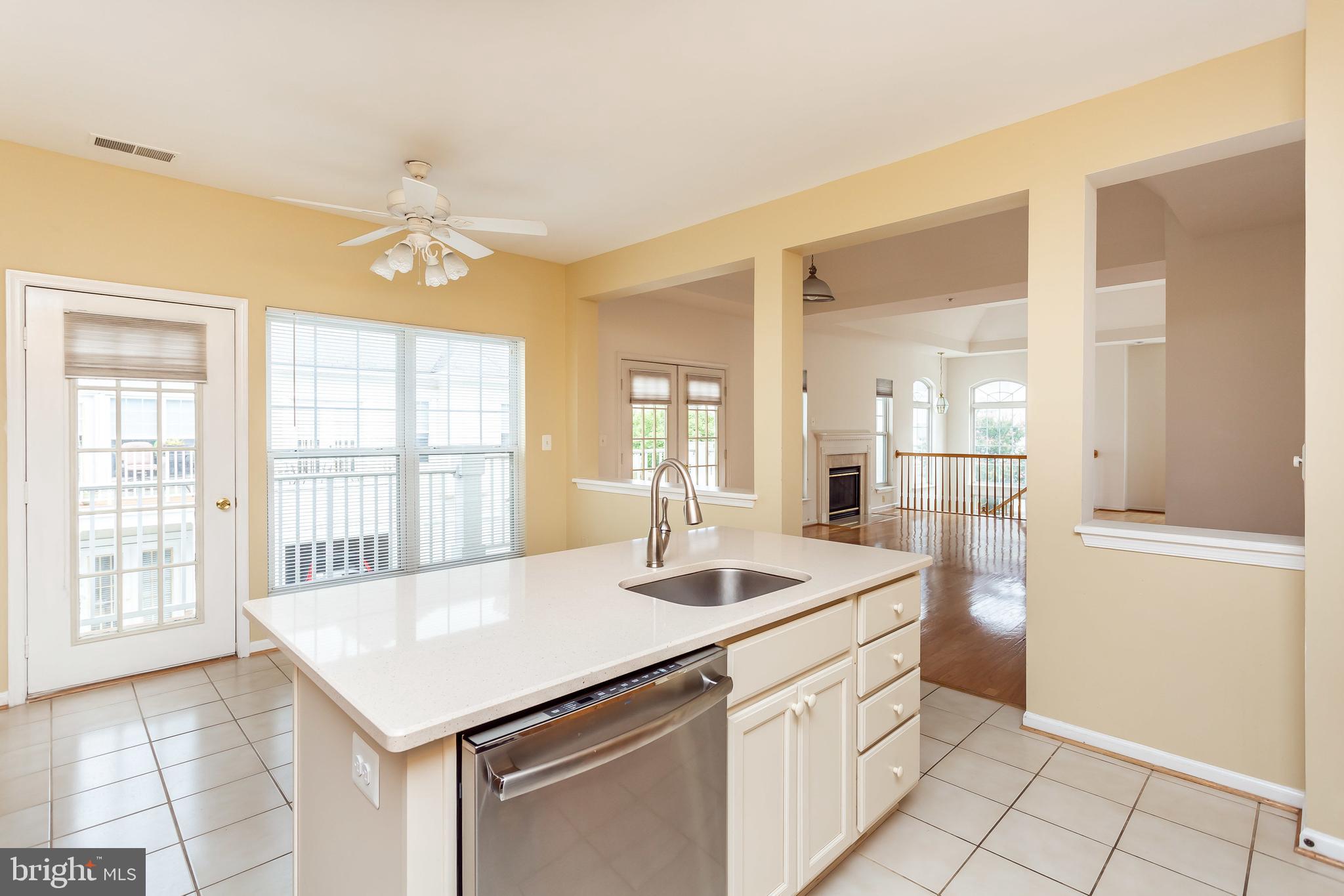 52 Barbican Way, Unit 52 Baltimore, MD 21208 - Photo 13 of 29 a room with a white cabinets and chandelier