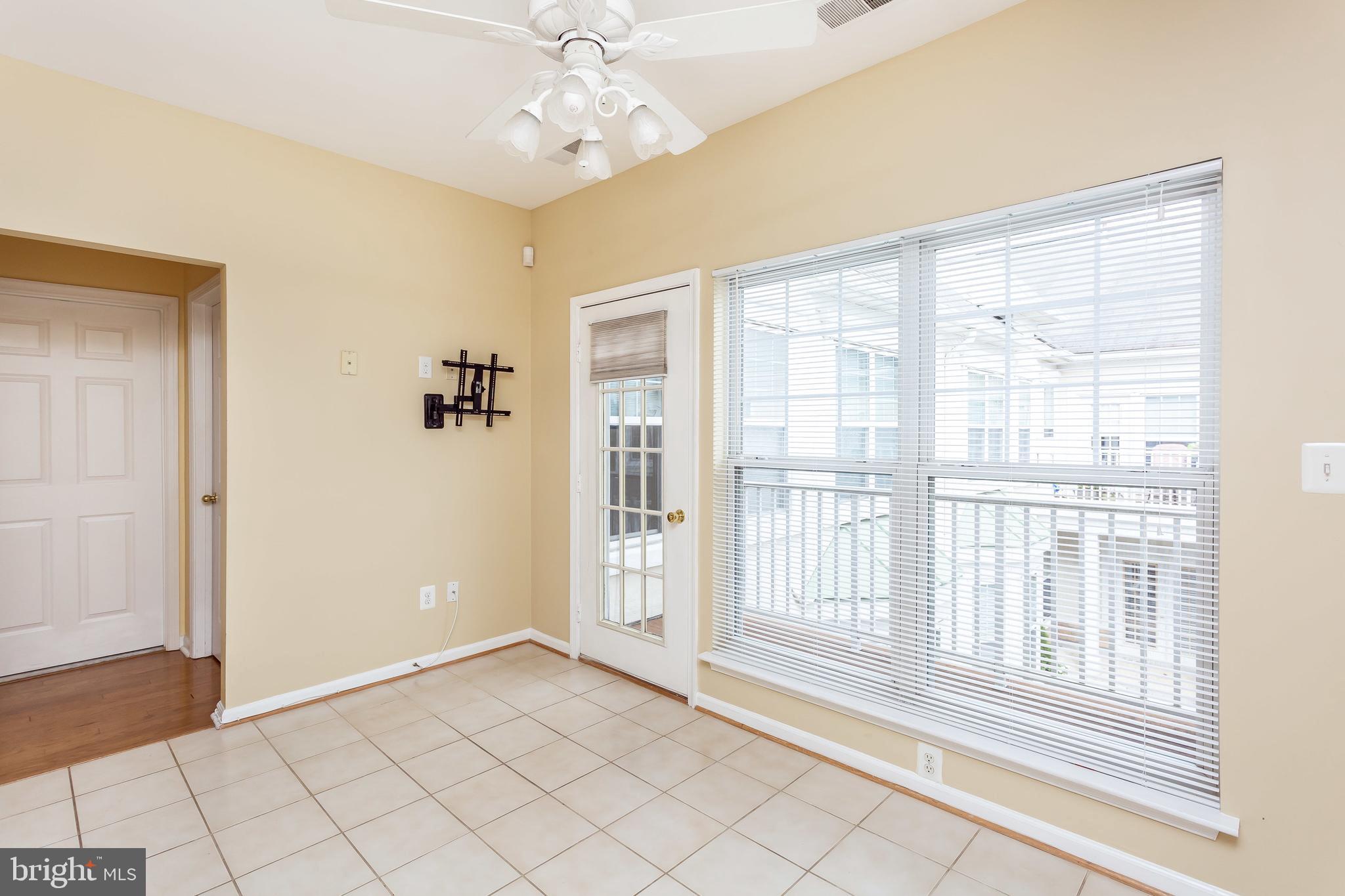 52 Barbican Way, Unit 52 Baltimore, MD 21208 - Photo 14 of 29 a view of an empty room with a window