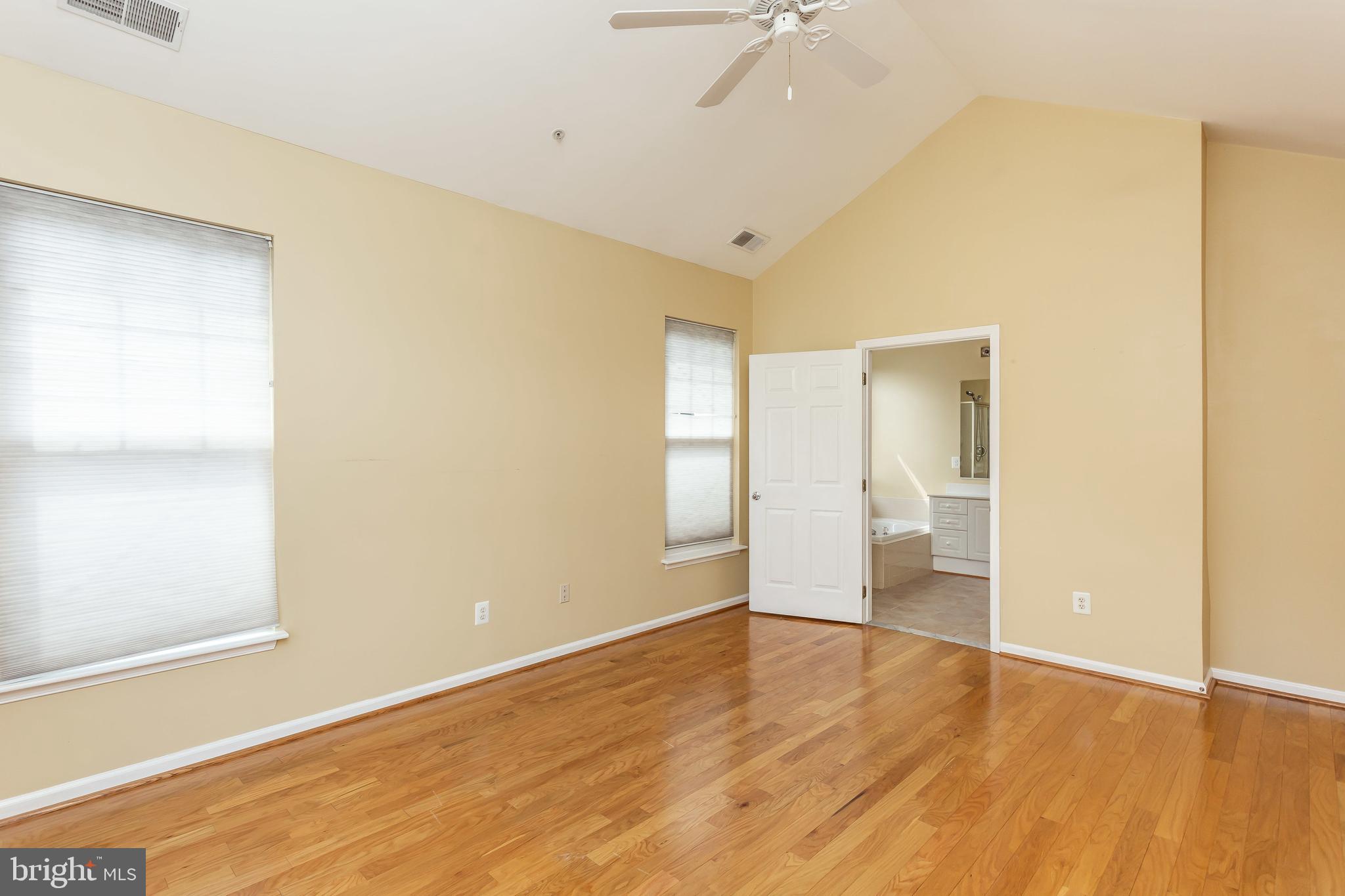 52 Barbican Way, Unit 52 Baltimore, MD 21208 - Photo 18 of 29 a view of empty room with wooden floor and fan