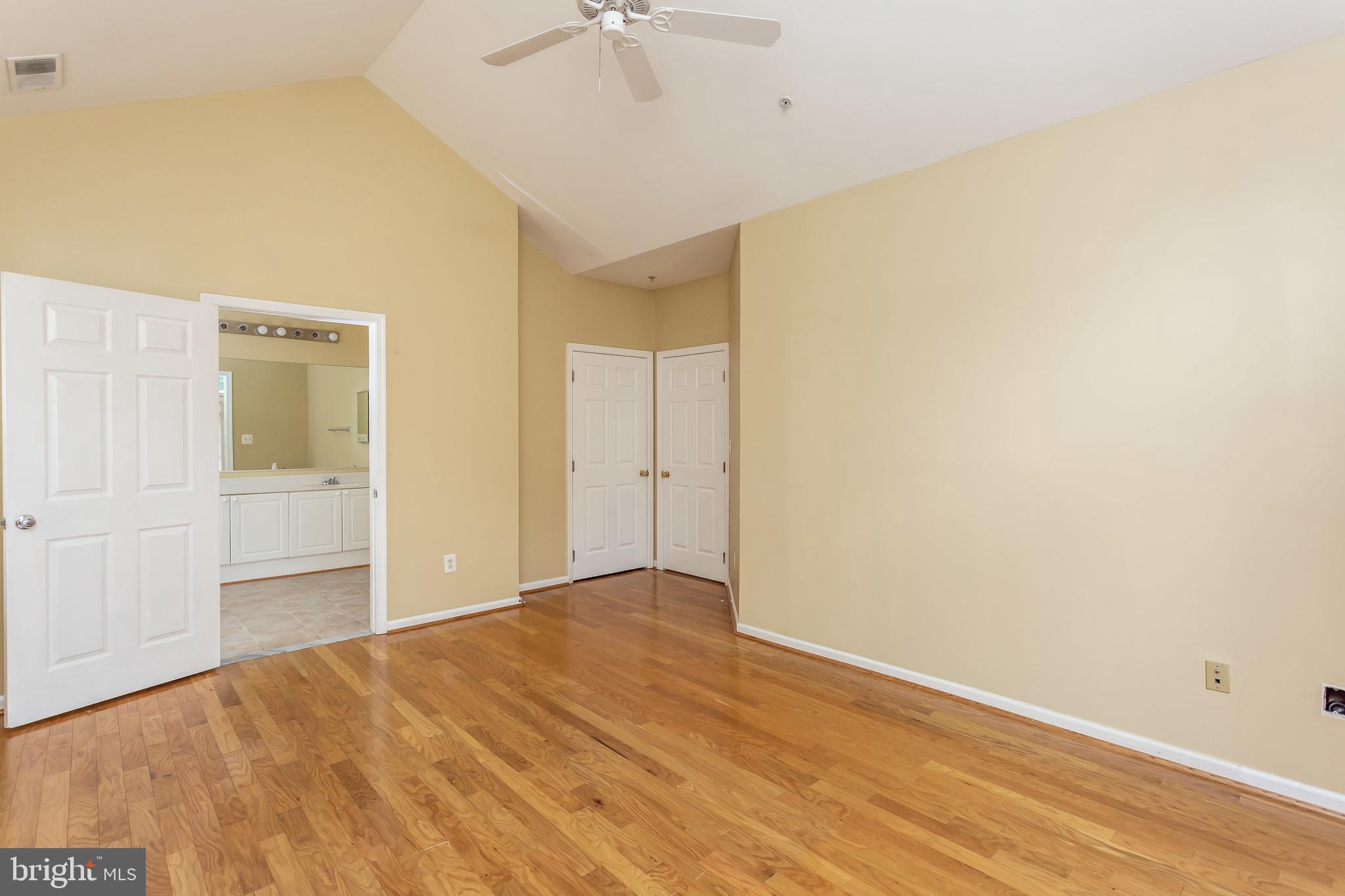 52 Barbican Way, Unit 52 Baltimore, MD 21208 - Photo 19 of 29 a view of an empty room with wooden floor