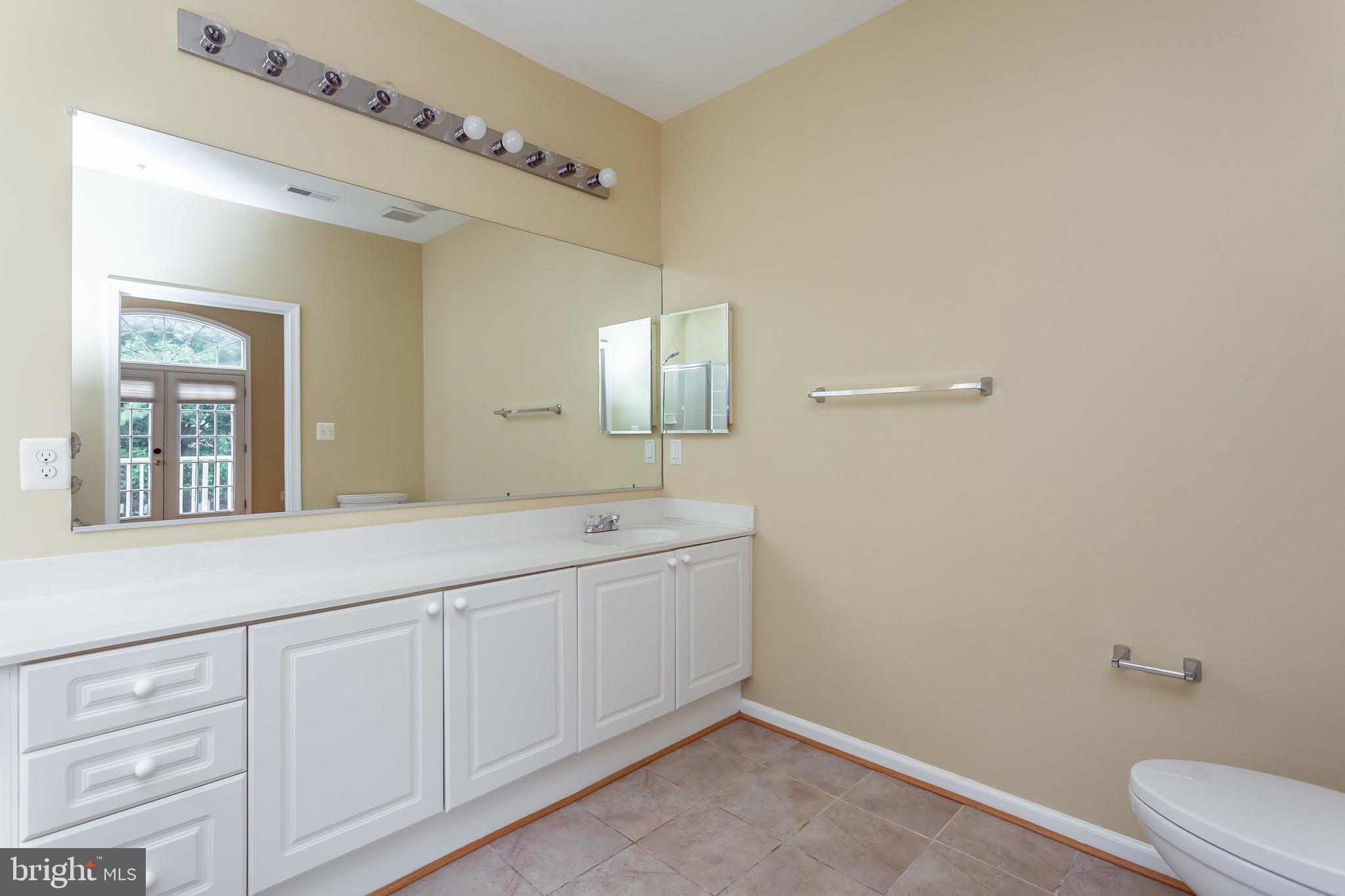 52 Barbican Way, Unit 52 Baltimore, MD 21208 - Photo 20 of 29 a bathroom with a sink and a mirror