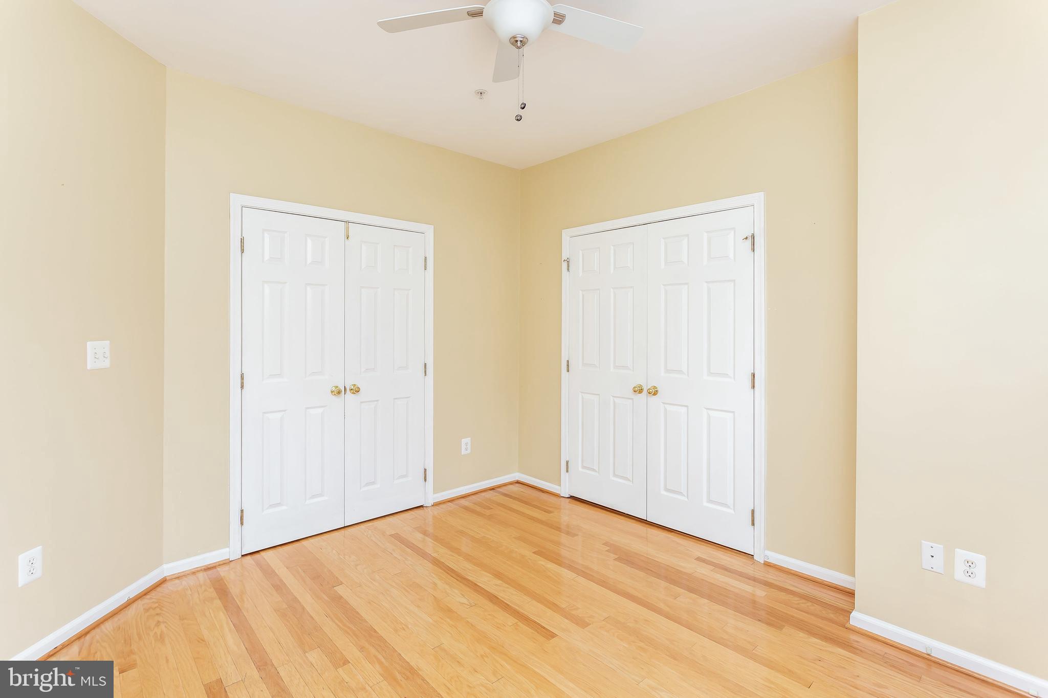 52 Barbican Way, Unit 52 Baltimore, MD 21208 - Photo 24 of 29 a view of a room with wooden floor and ceiling fan