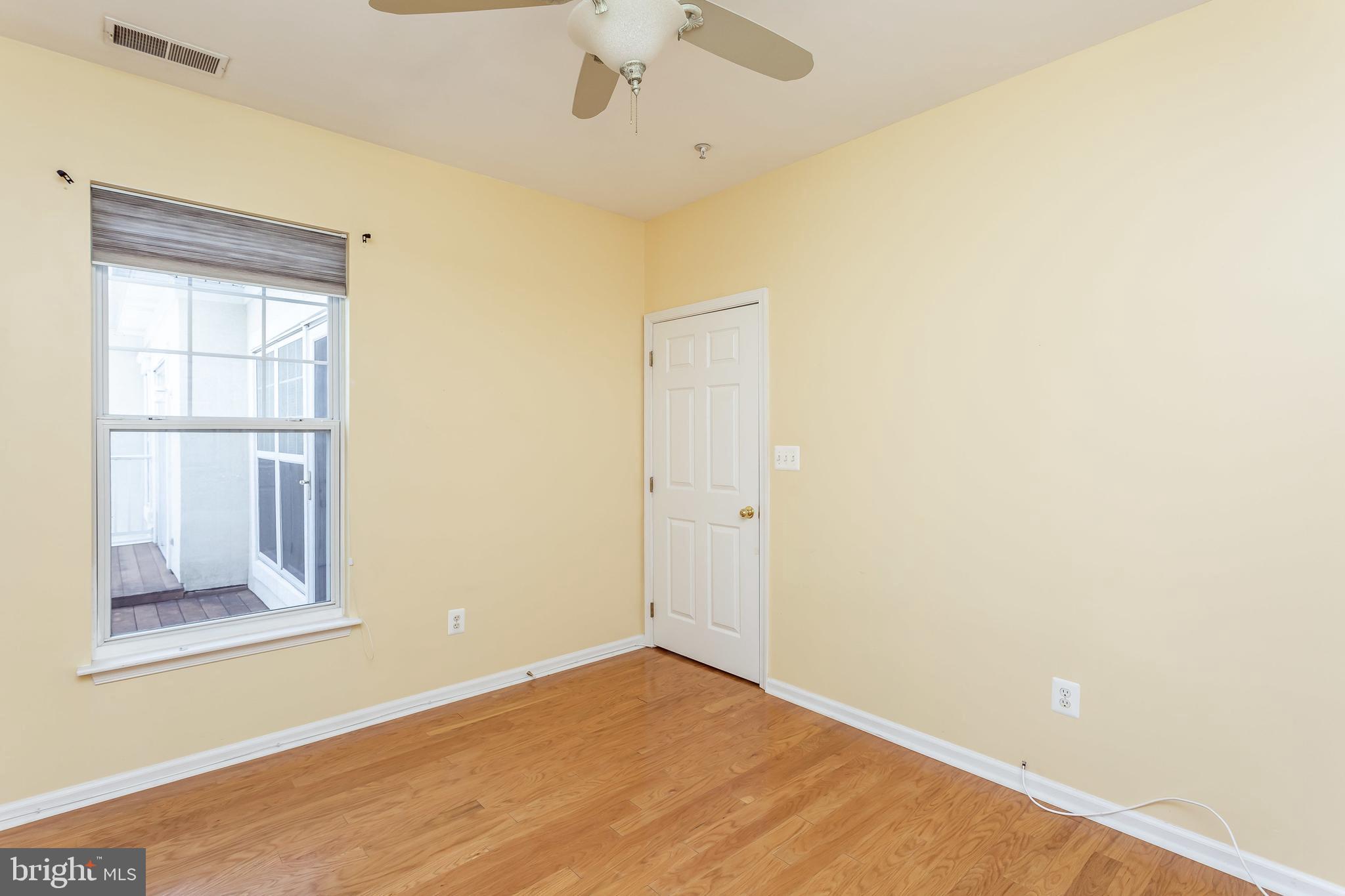 52 Barbican Way, Unit 52 Baltimore, MD 21208 - Photo 28 of 29 a view of an empty room with a window