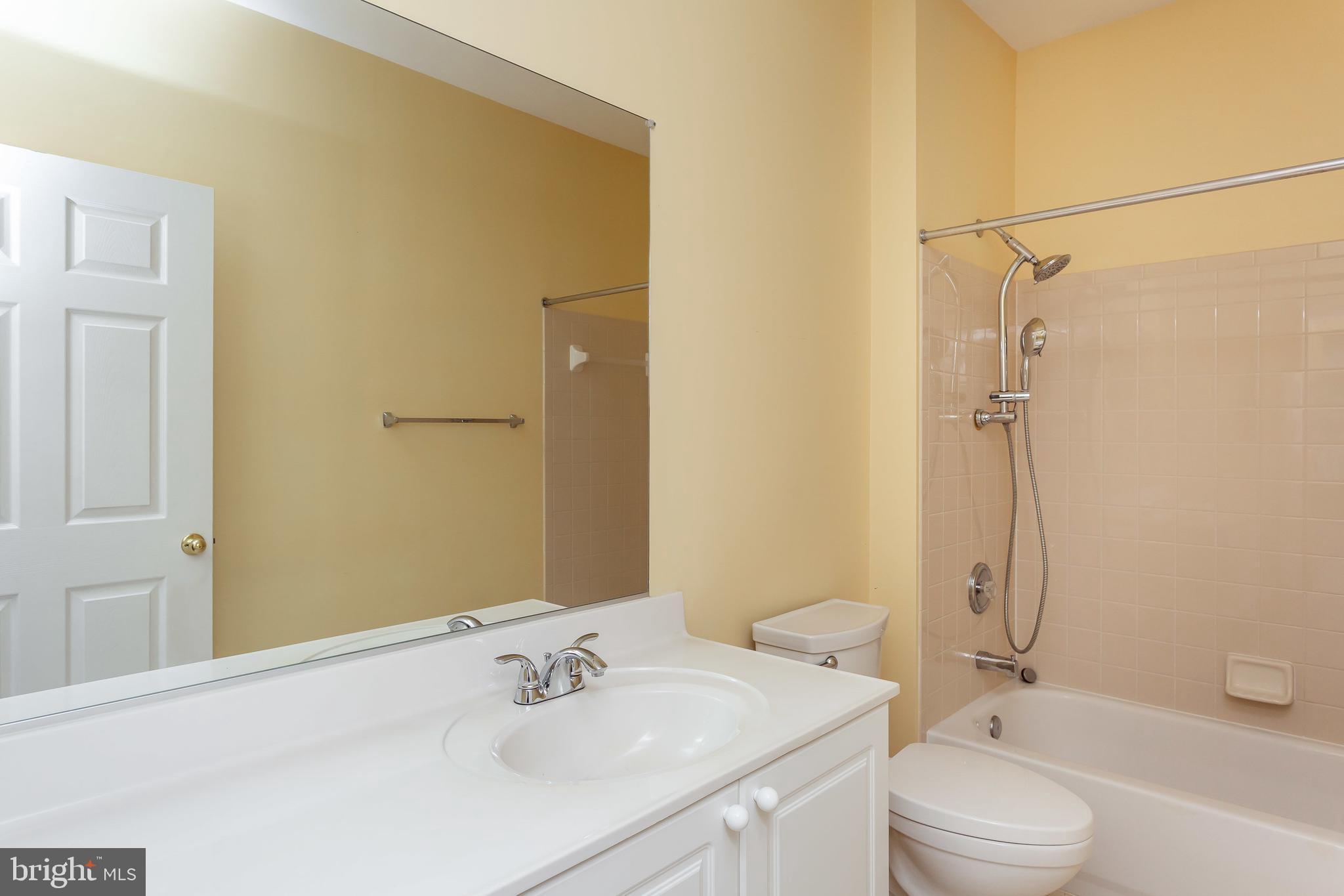 52 Barbican Way, Unit 52 Baltimore, MD 21208 - Photo 29 of 29 a bathroom with a sink a toilet and shower