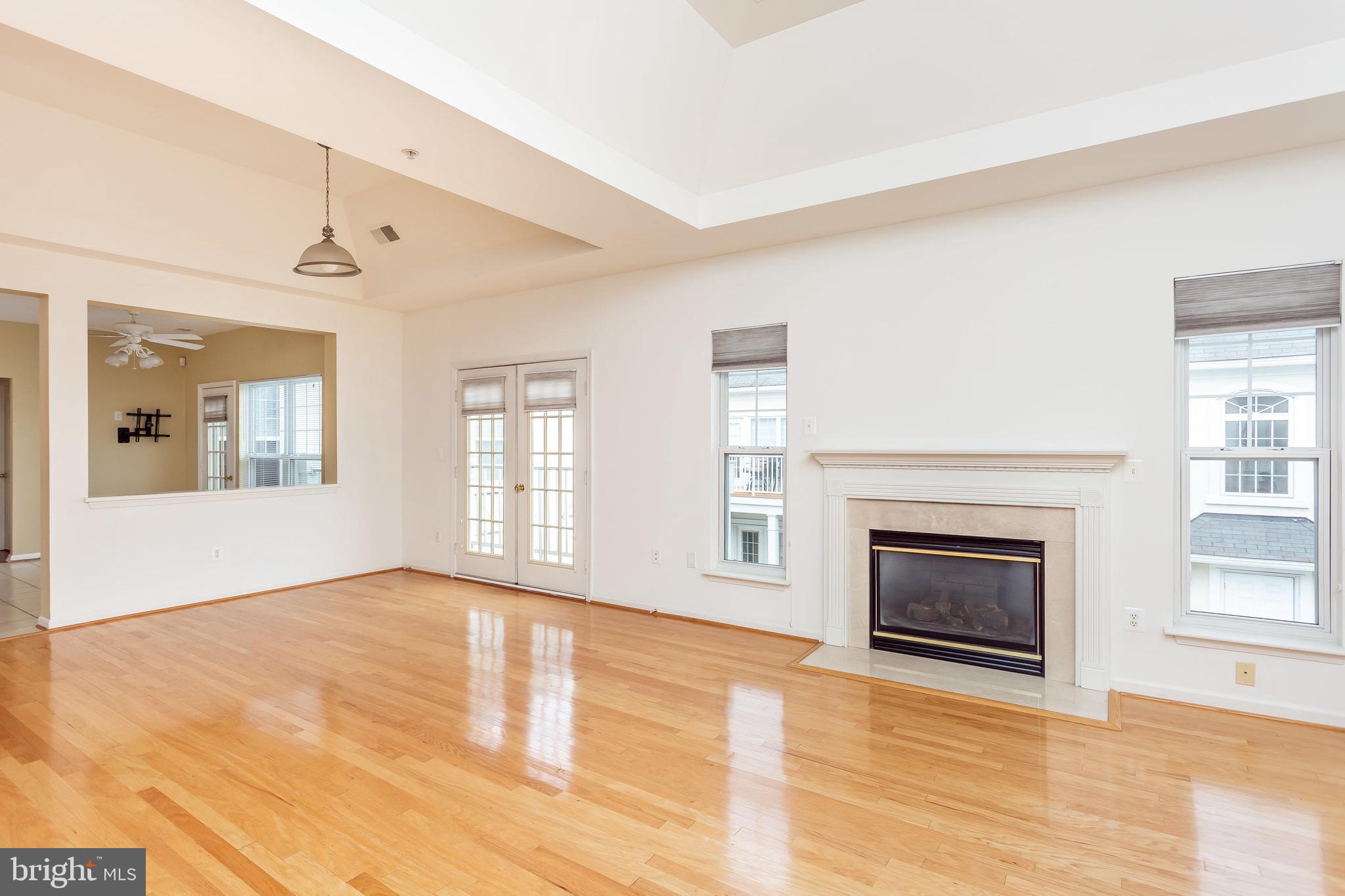 52 Barbican Way, Unit 52 Baltimore, MD 21208 - Photo 6 of 29 a view of an empty room with window and fire place