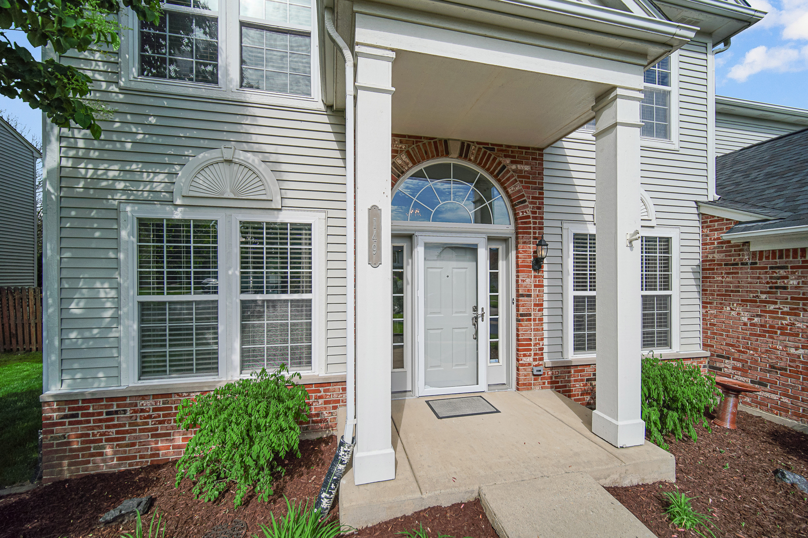 149 Lilac Street Bolingbrook, IL 60490 - Photo 2 of 3 a front view of a house with large windows