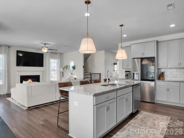 a kitchen with a sink stove and microwave