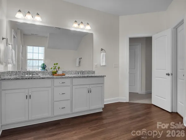 a bedroom with furniture and window