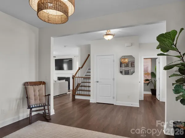 a view of room with furniture and wooden floor