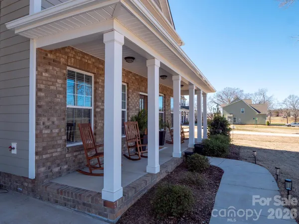 a view of a swimming pool and lounge chairs