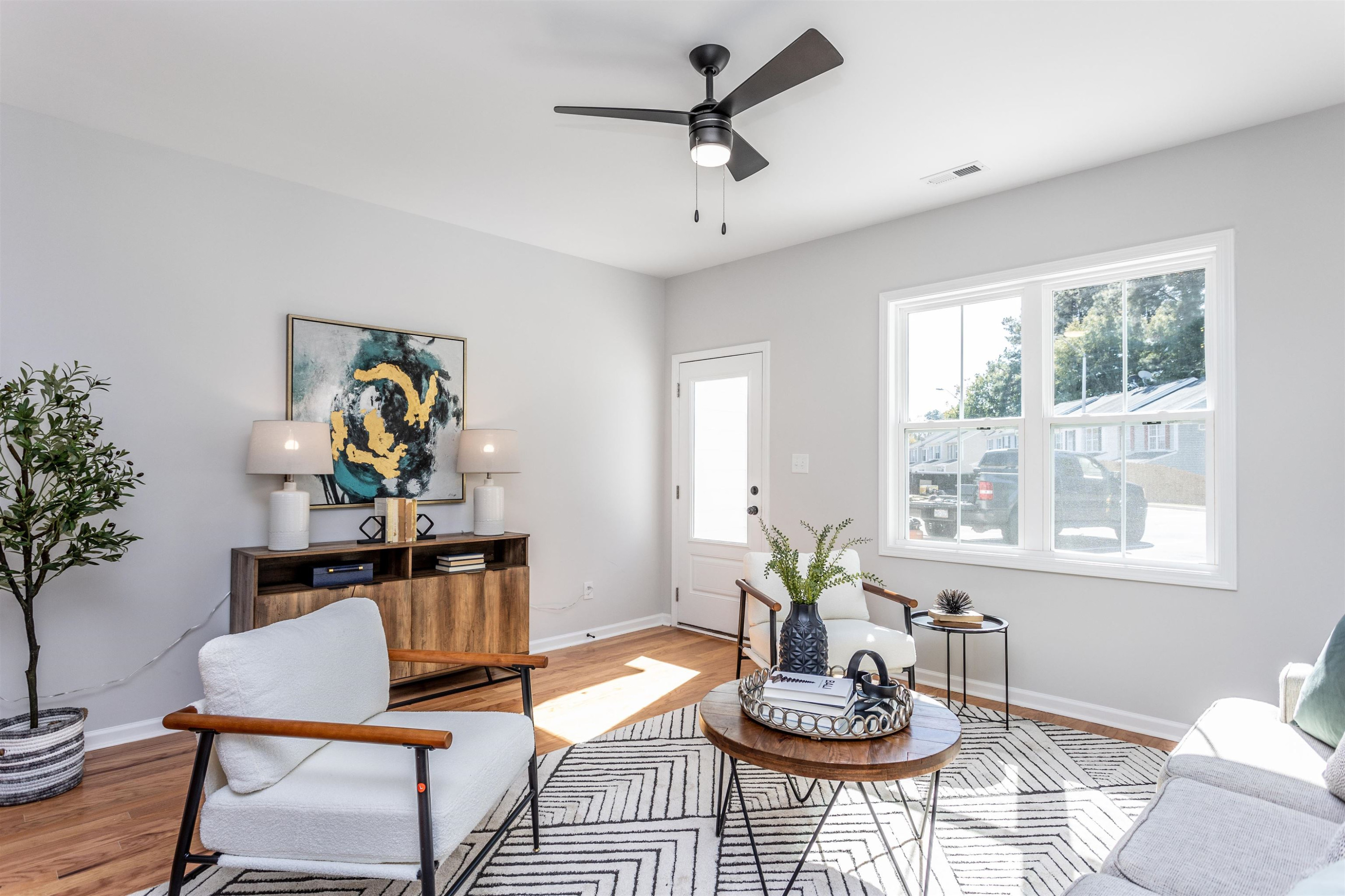626 Rush Street Raleigh, NC 27610 - Photo 11 of 26 a living room with furniture and a potted plant