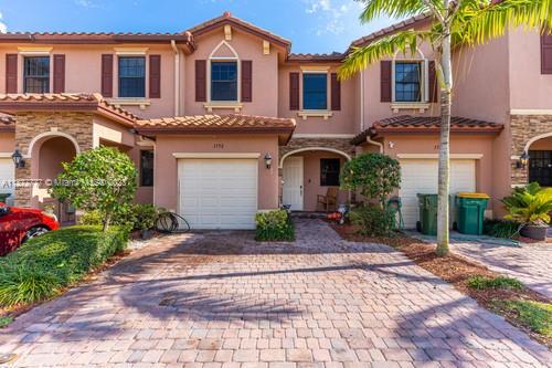 3772 Southeast 2nd Drive, Unit 3772 Homestead, FL 33033 - Photo 1 of 36 a front view of a house with garden