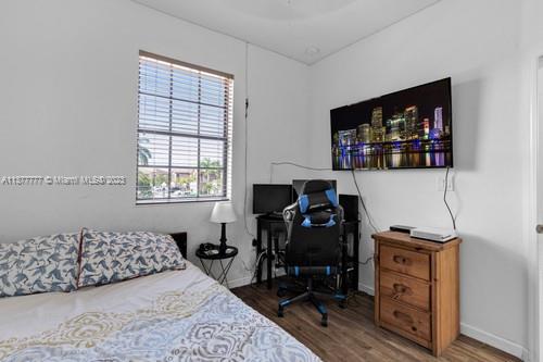 3772 Southeast 2nd Drive, Unit 3772 Homestead, FL 33033 - Photo 13 of 36 a bedroom with a bed and a window