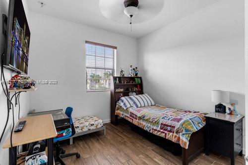 3772 Southeast 2nd Drive, Unit 3772 Homestead, FL 33033 - Photo 15 of 36 a bedroom with a bed and a desk