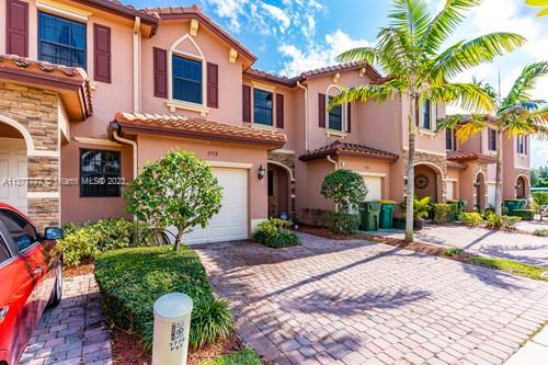 3772 Southeast 2nd Drive, Unit 3772 Homestead, FL 33033 - Photo 2 of 36 a front view of a house with garden