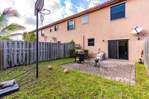 3772 Southeast 2nd Drive, Unit 3772 Homestead, FL 33033 - Photo 25 of 36 a backyard of a house with table and chairs