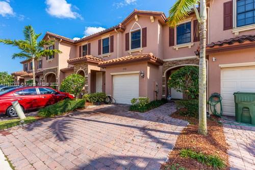 3772 Southeast 2nd Drive, Unit 3772 Homestead, FL 33033 - Photo 3 of 36 a front view of a house with garden