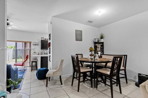 3772 Southeast 2nd Drive, Unit 3772 Homestead, FL 33033 - Photo 6 of 36 a view of a livingroom with furniture and front door