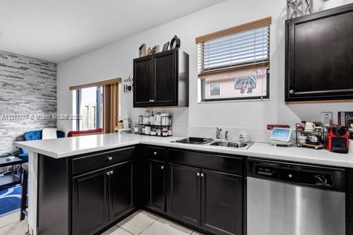3772 Southeast 2nd Drive, Unit 3772 Homestead, FL 33033 - Photo 10 of 36 a kitchen with a sink and a stove top oven with wooden floor