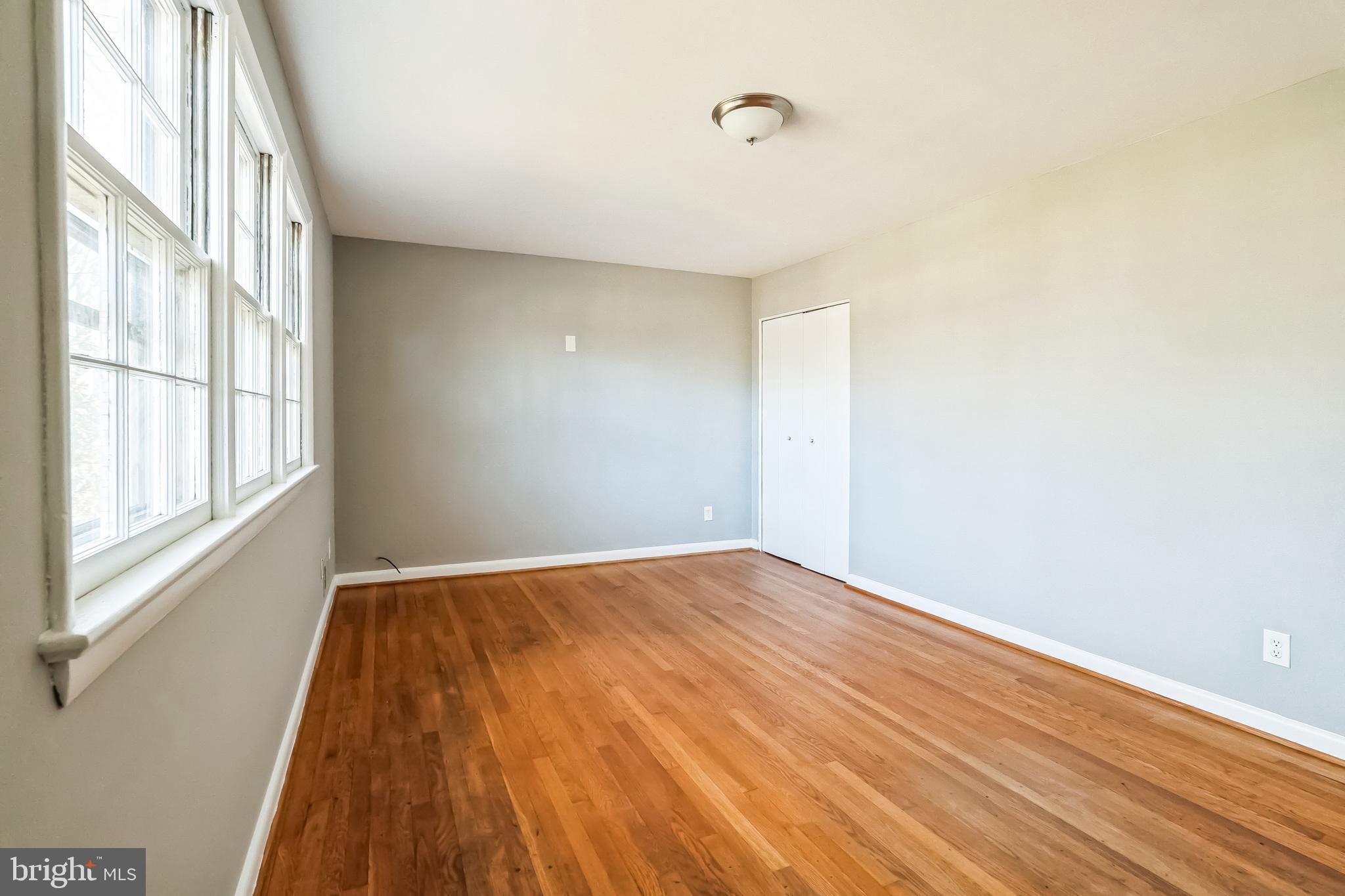 2215 Solmar Drive Silver Spring, MD 20904 - Photo 24 of 34 a view of empty room with wooden floor and fan